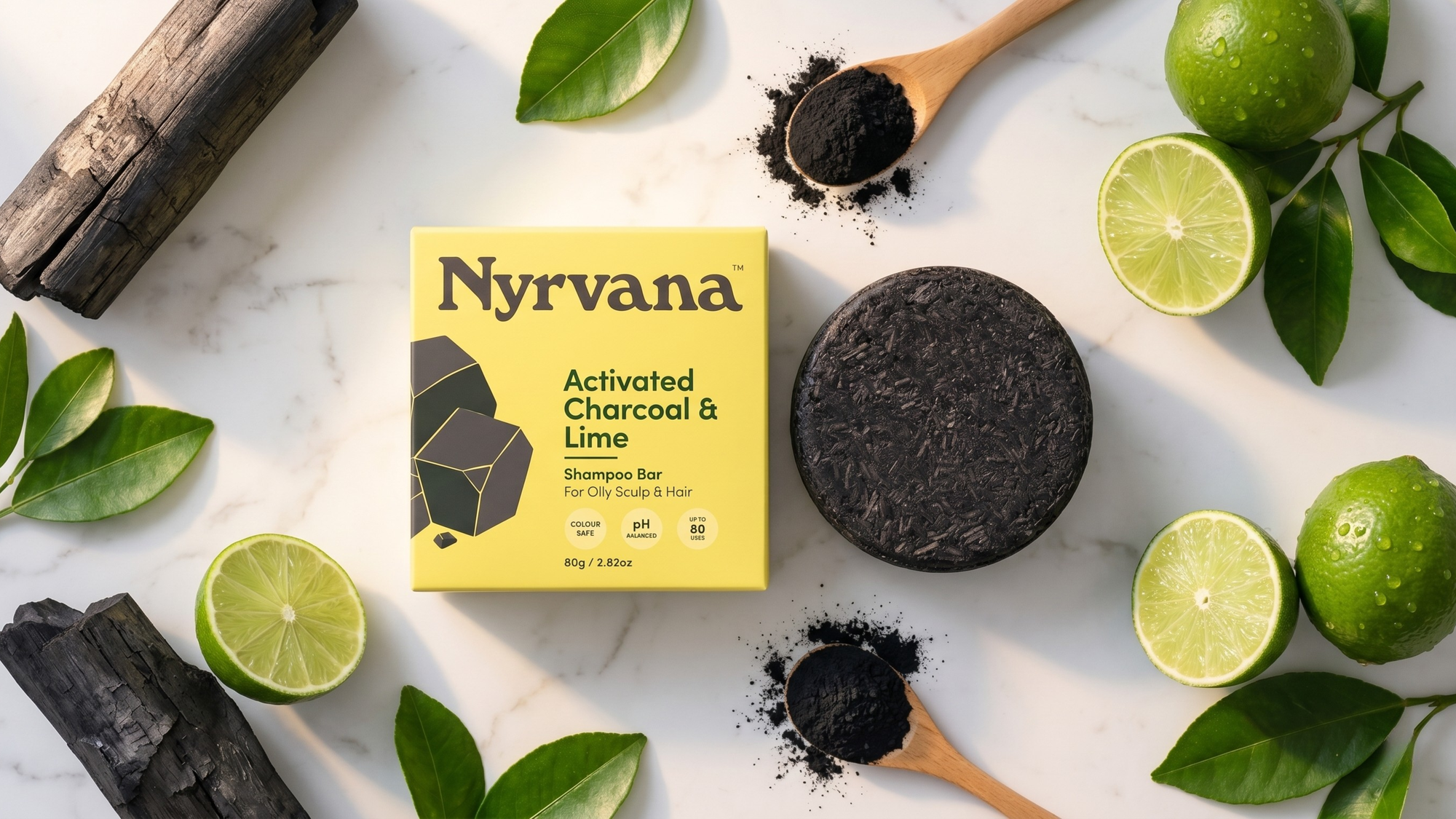 Activated charcoal and lime shampoo bar flat lay with natural ingredients — charcoal shampoo bar for oily scalp and hard water hair in UAE