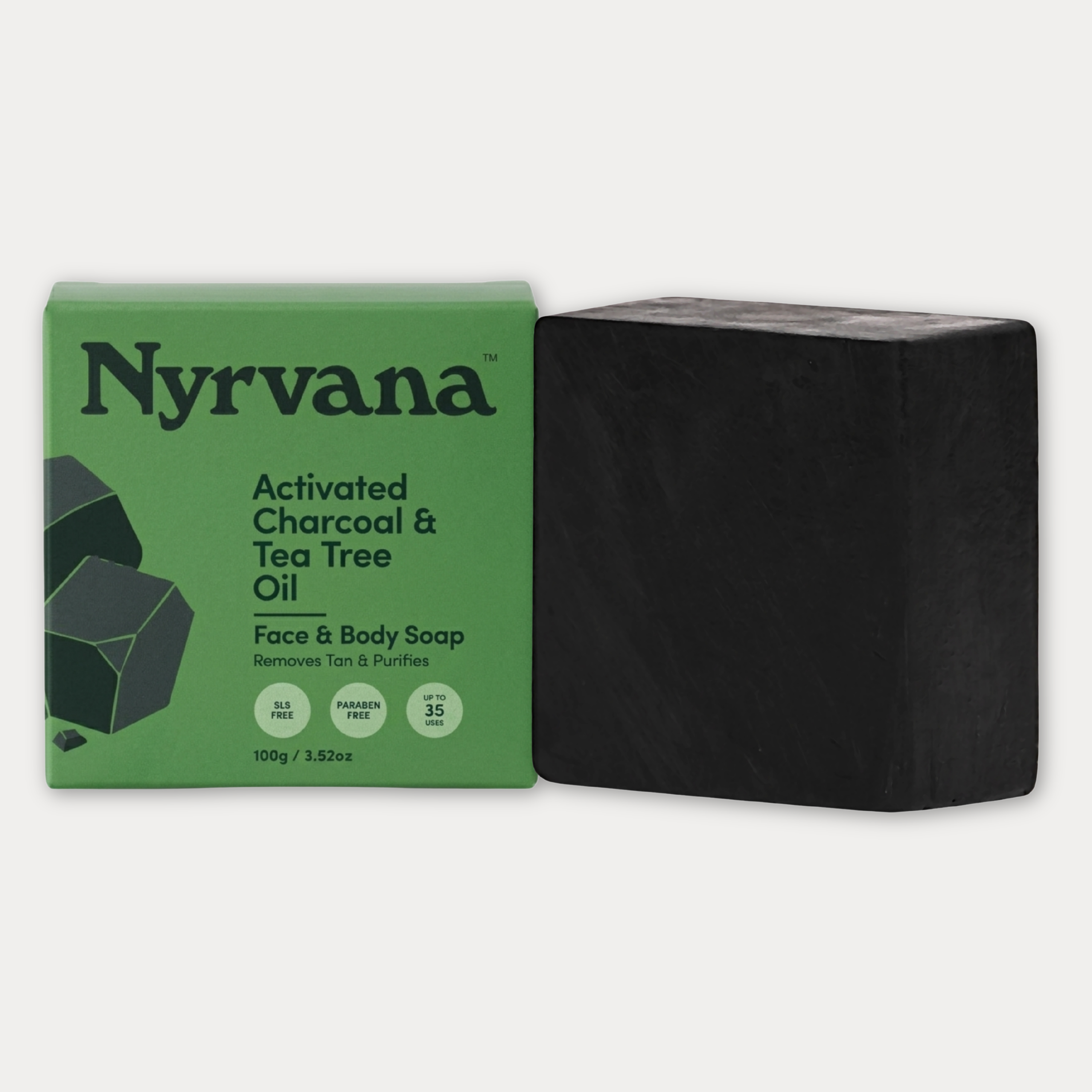 Nyrvana Activated Charcoal and Tea Tree Oil Face and Body Soap 100g with green box and black bar on white background