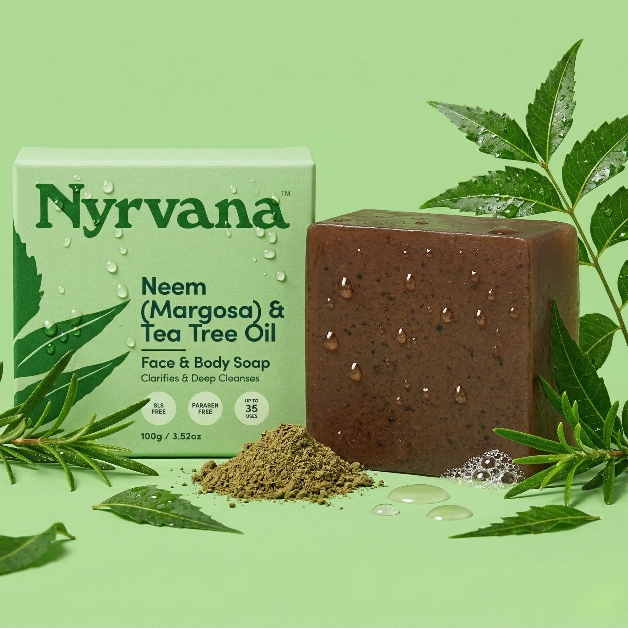 Nyrvana Neem Tea Tree Soap 100g with box surrounded by fresh neem leaves neem powder and tea tree sprigs on green background with water droplets