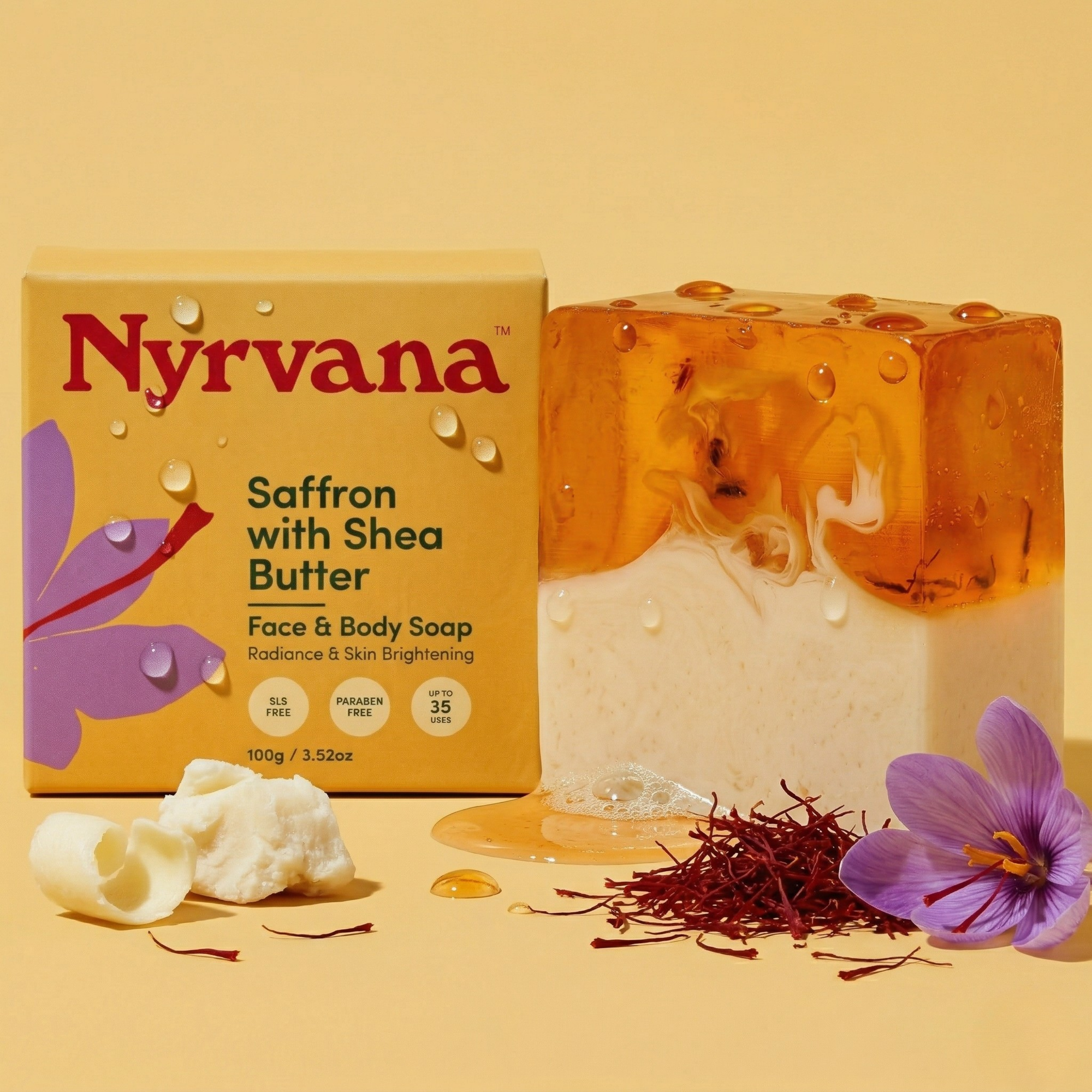 Nyrvana Saffron Shea Butter Soap 100g with box surrounded by saffron threads raw shea butter and purple crocus flower on yellow background