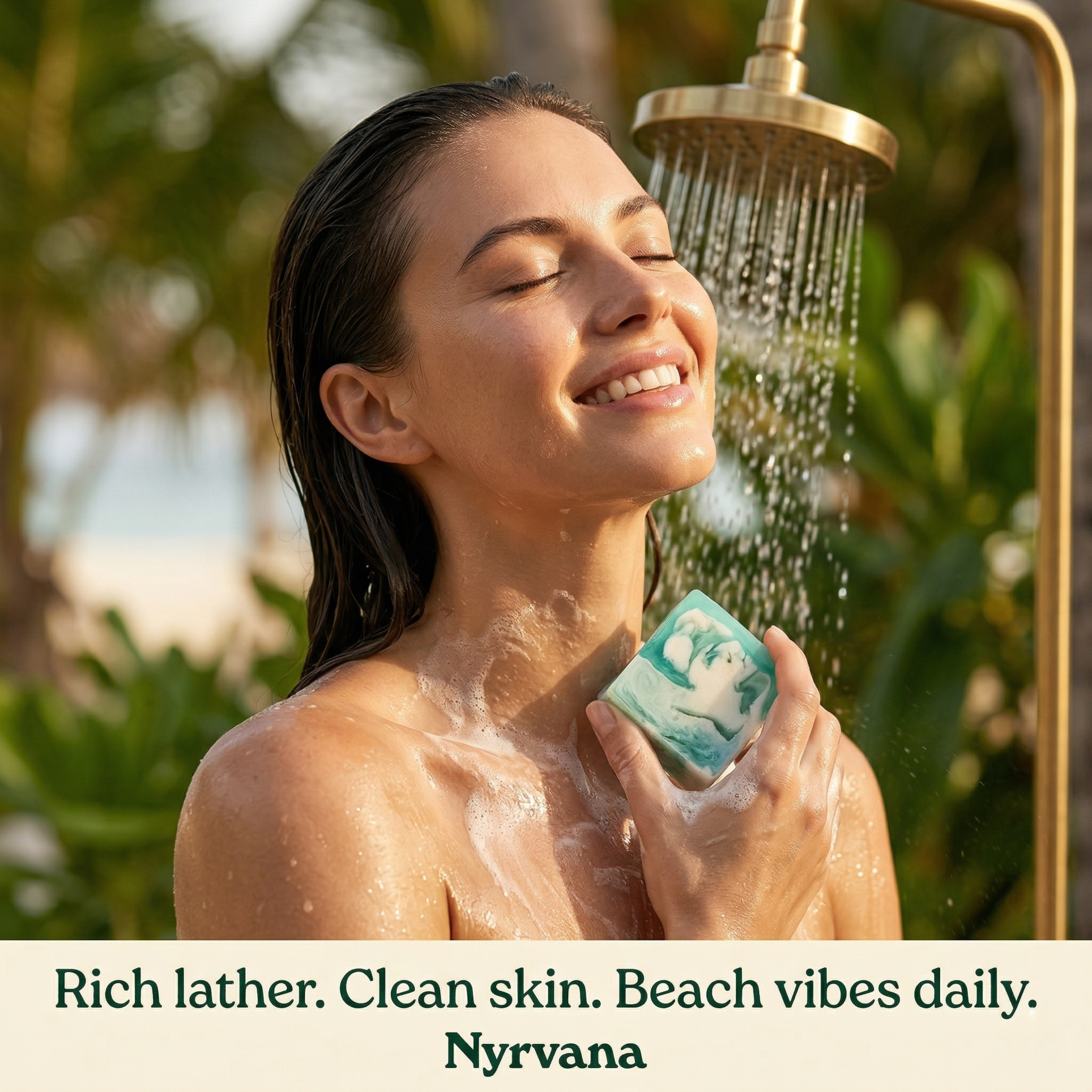 Smiling woman showering outdoors with Nyrvana Sea Salt Rhassoul Clay Soap under gold shower head with tropical palm trees in background